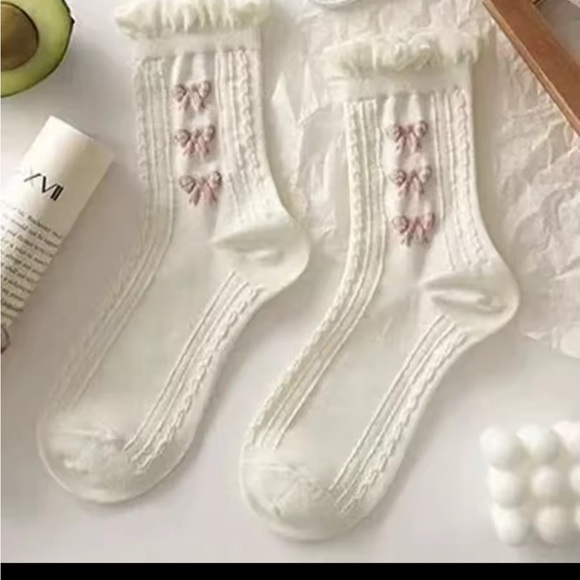 Elegant Cream Socks with Bow Accents
0219 - Picture 5 of 5